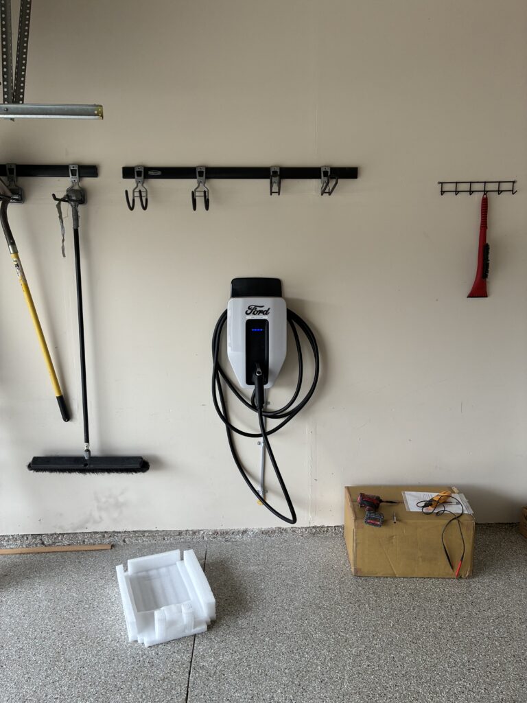 Ford EV charger installed on garage wall by Del Haven Electric in Auburn WA